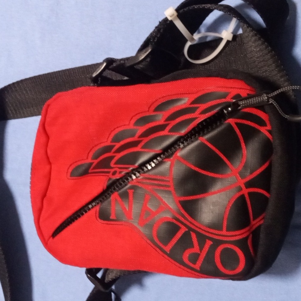 Air Jordan 8 inch cross body bag with zipper on top and zipper on side for pH